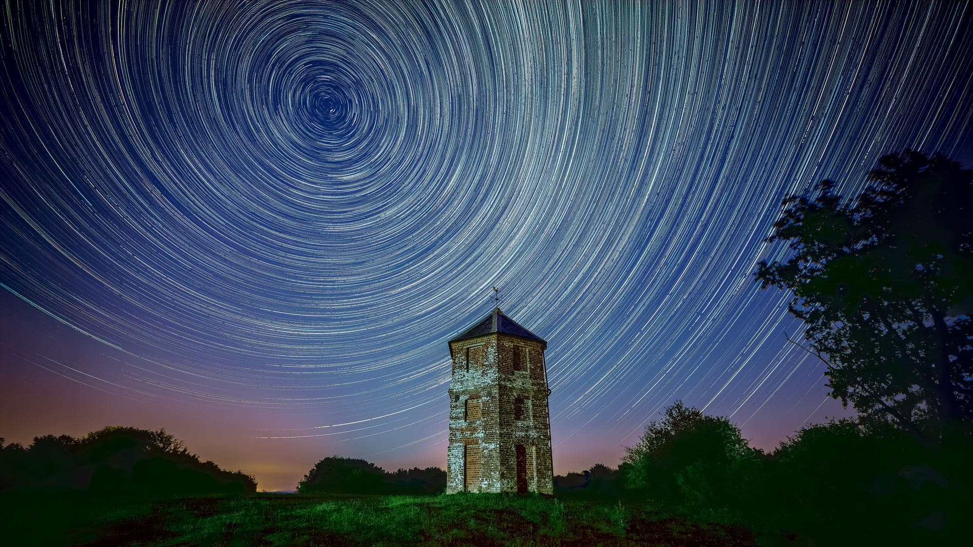 Concentric star trail arcs over Pepperbox Hill, captured with a multi-hour stacked exposure