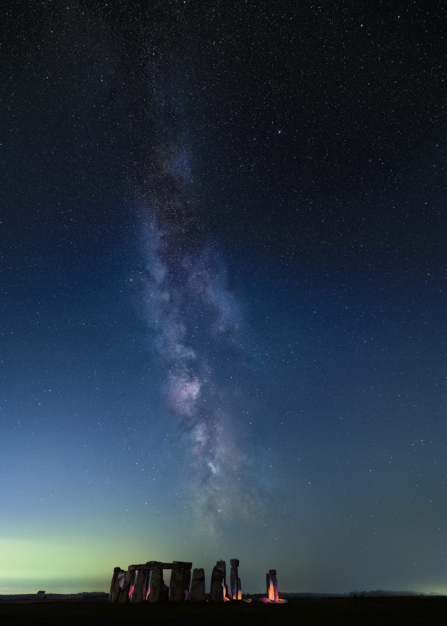 The Galactic Core of the Milky Way rising over the standing stones of Stonehenge on a clear, moonless night